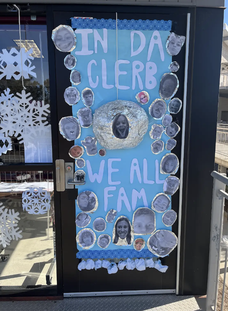 Students' faces and disco balls decorate the door of AP Psychology teacher Lynn Leahy's classroom. Students' pictures were used on each disco ball.